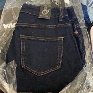 Two pairs of clear heels and jeans